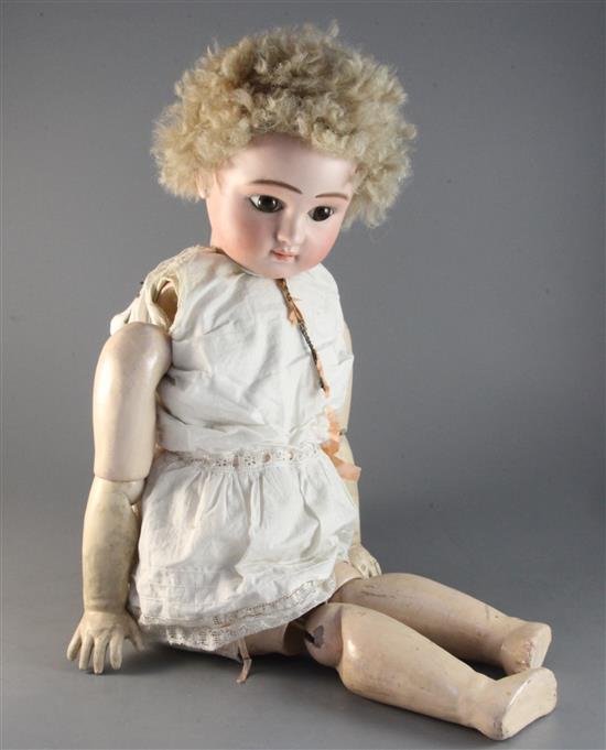 A late 19th century German bisque head doll 29in.